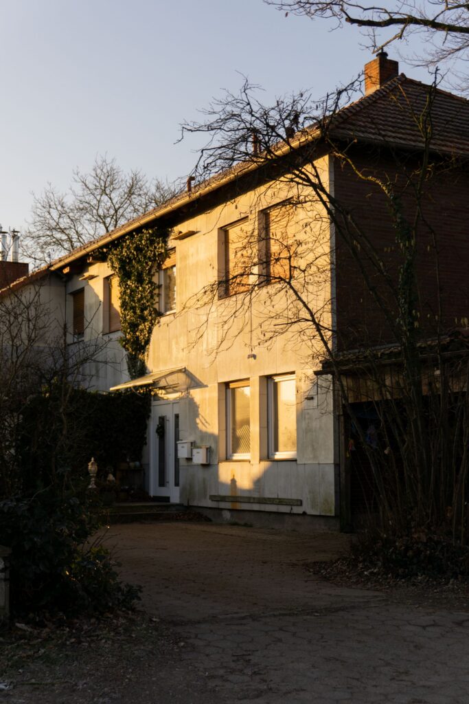 Charming rural house bathed in golden sunlight during fall, representing seller preparation