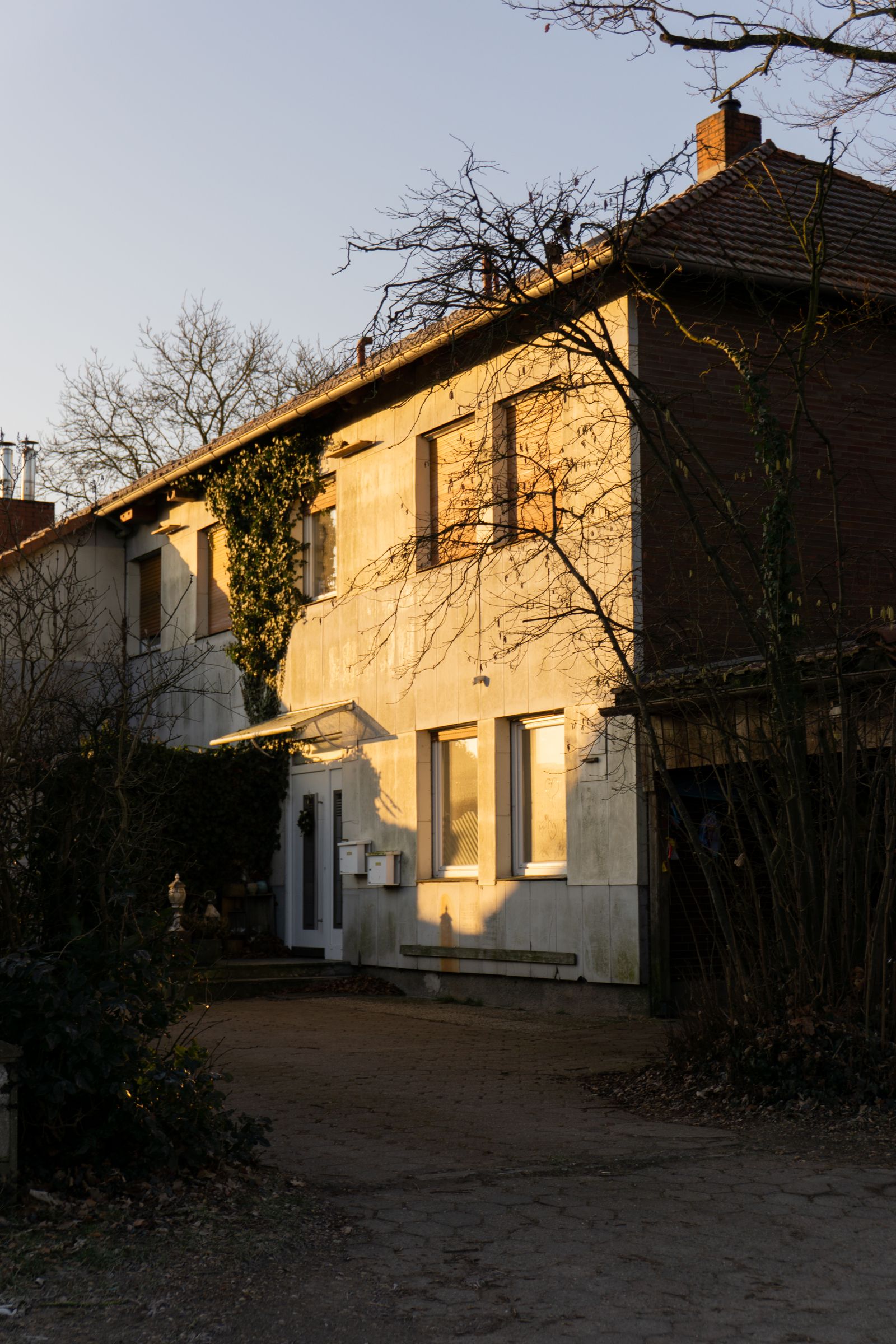 Charming rural house bathed in golden sunlight during fall, representing seller preparation